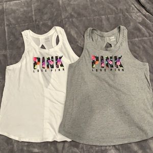 Pink by Victoria’s Secret tank top with opening in the back size large.